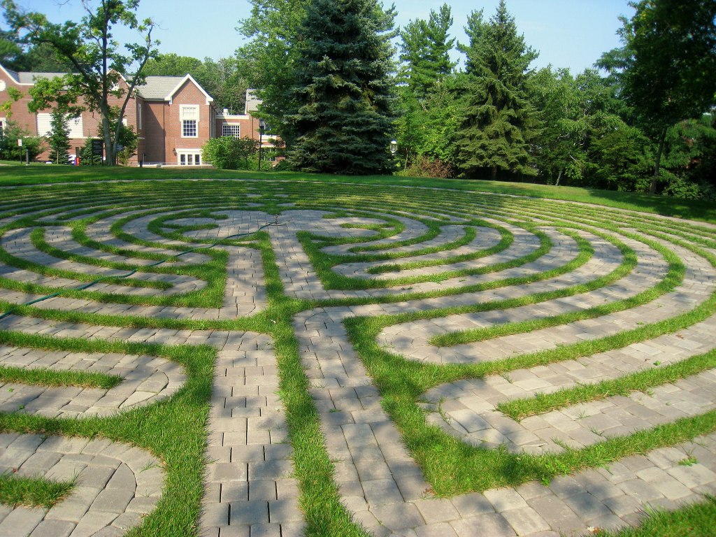 a labyrinth of paving stones and grass